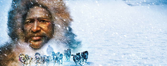 Matthew Henson wears a fur coat as dogs pull a sled during a snowstorm
