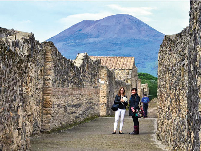 two travelers standing in the ruins of Pompeii