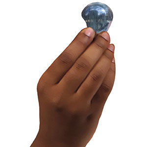 a hand holding up a pod of water