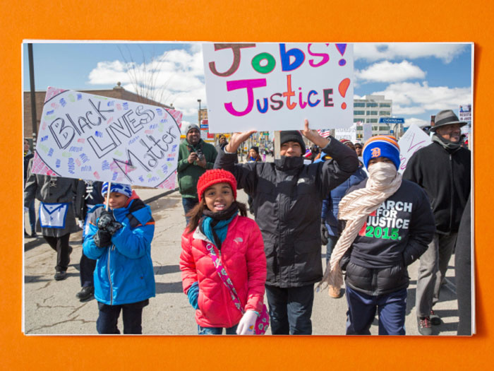 Children and adults protesting and marching for justice