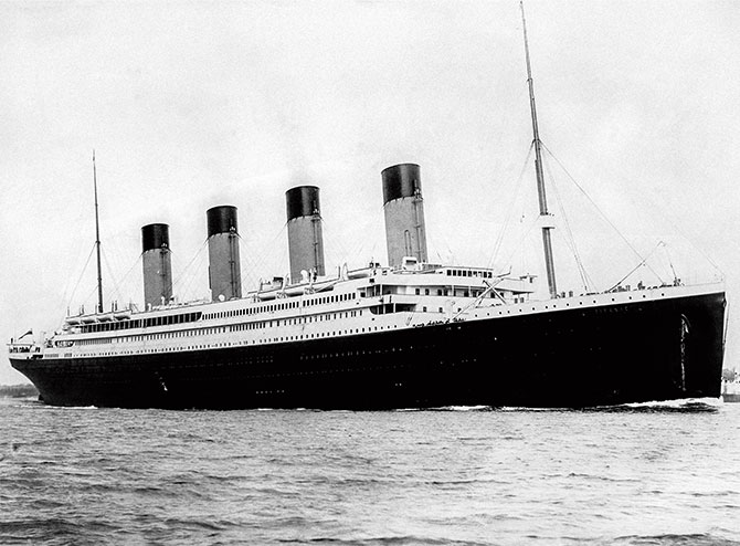 Enlargeable black and white photo of a large ship out on the sea
