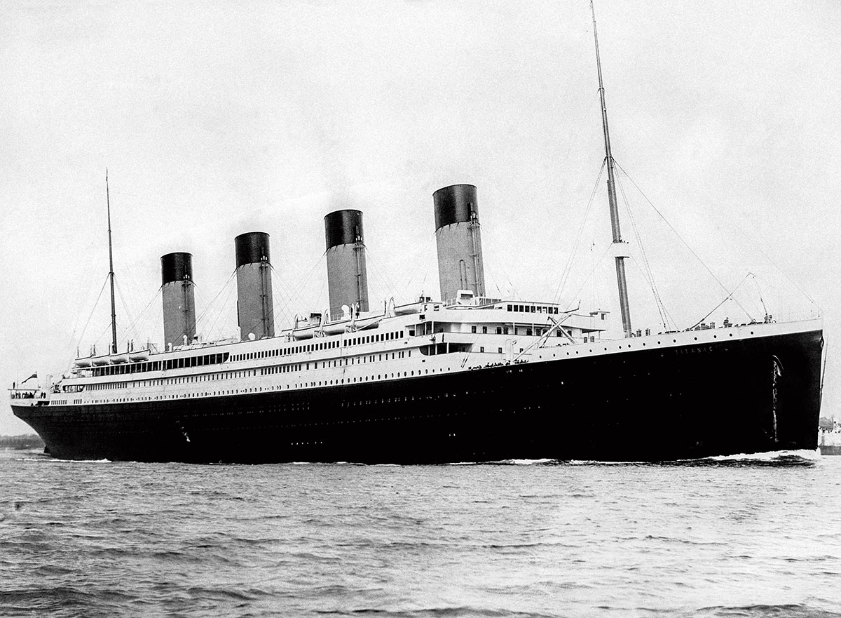 Black and white photo of a large ship out on the sea