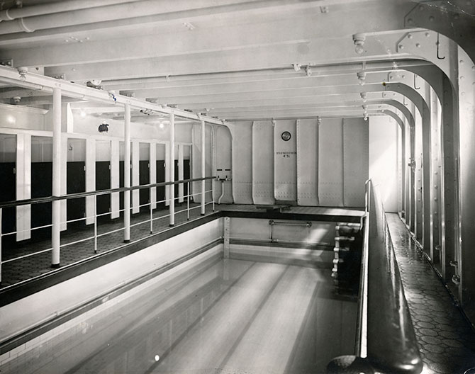 A black and white photo of a empty swimming pool