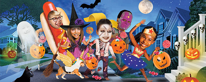 several children trick or treating while wearing Halloween costumes