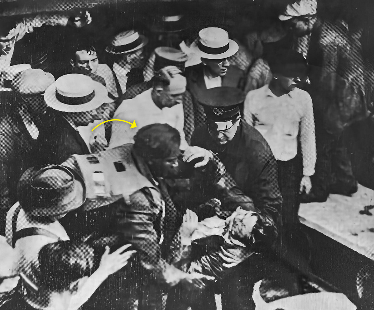 Black & white photo of Garrett Morgan rescuing a man from a tunnel