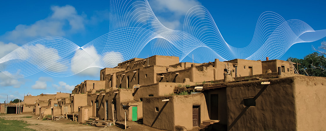 Image of a town made out of clay with thin white waves pictured in sky