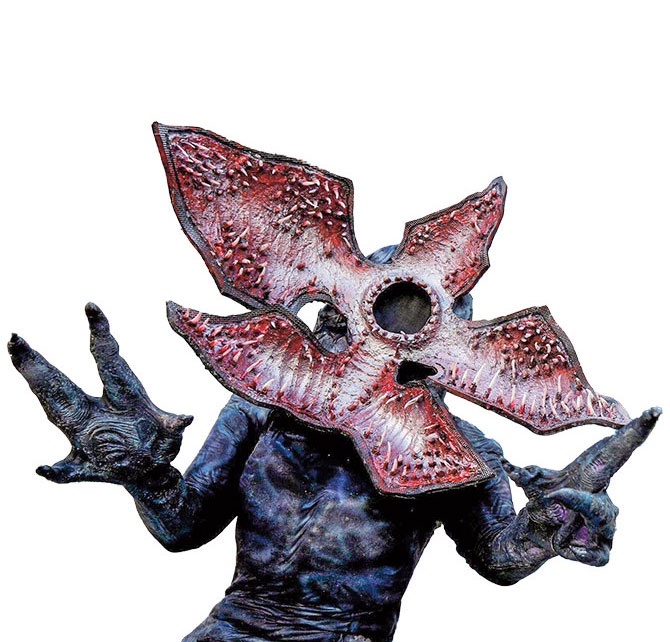 A gray creature with a head that opens like a flower to show sharp teeth lining the opening