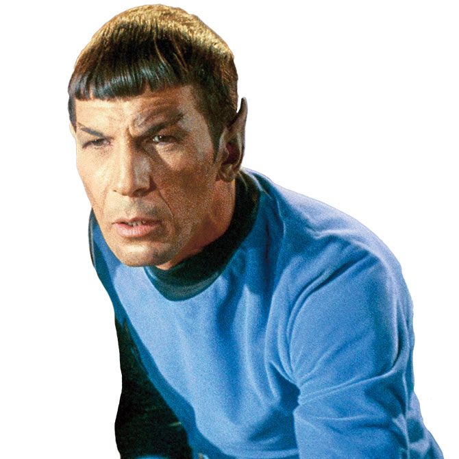 A man with pointy ears wearing a blue shirt 